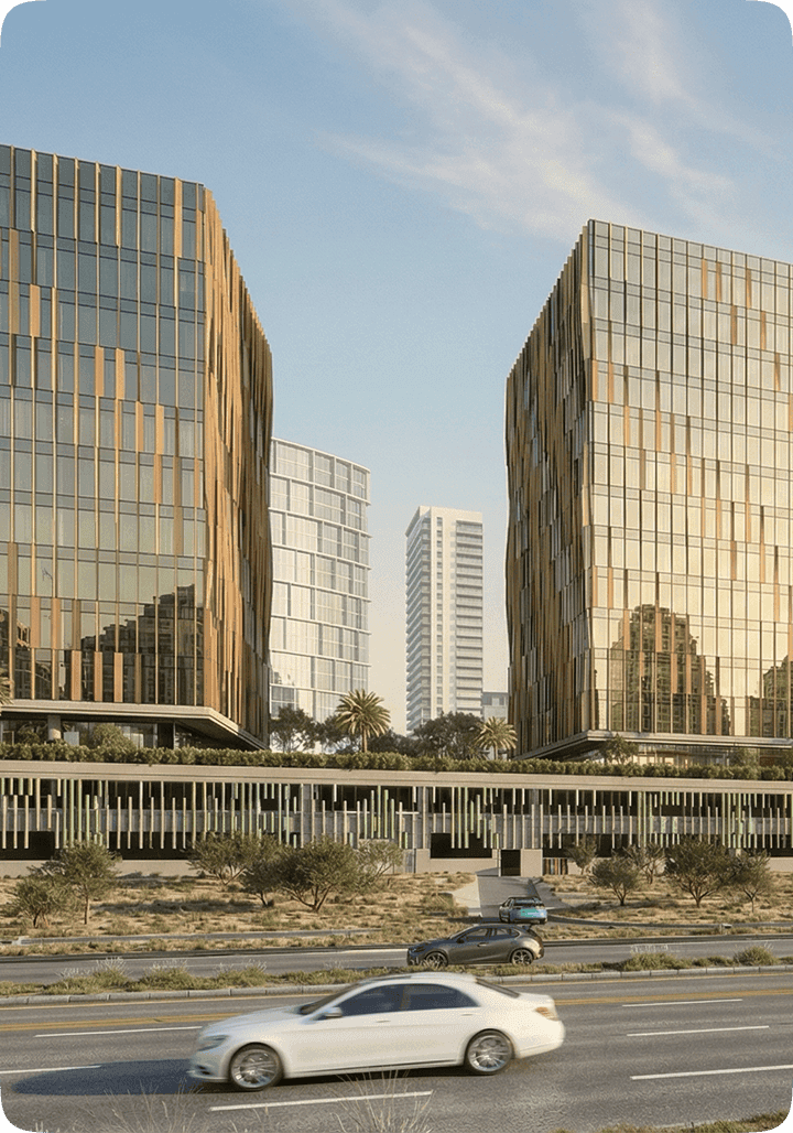 Glass office towers along a highway in Ras Al Khaimah